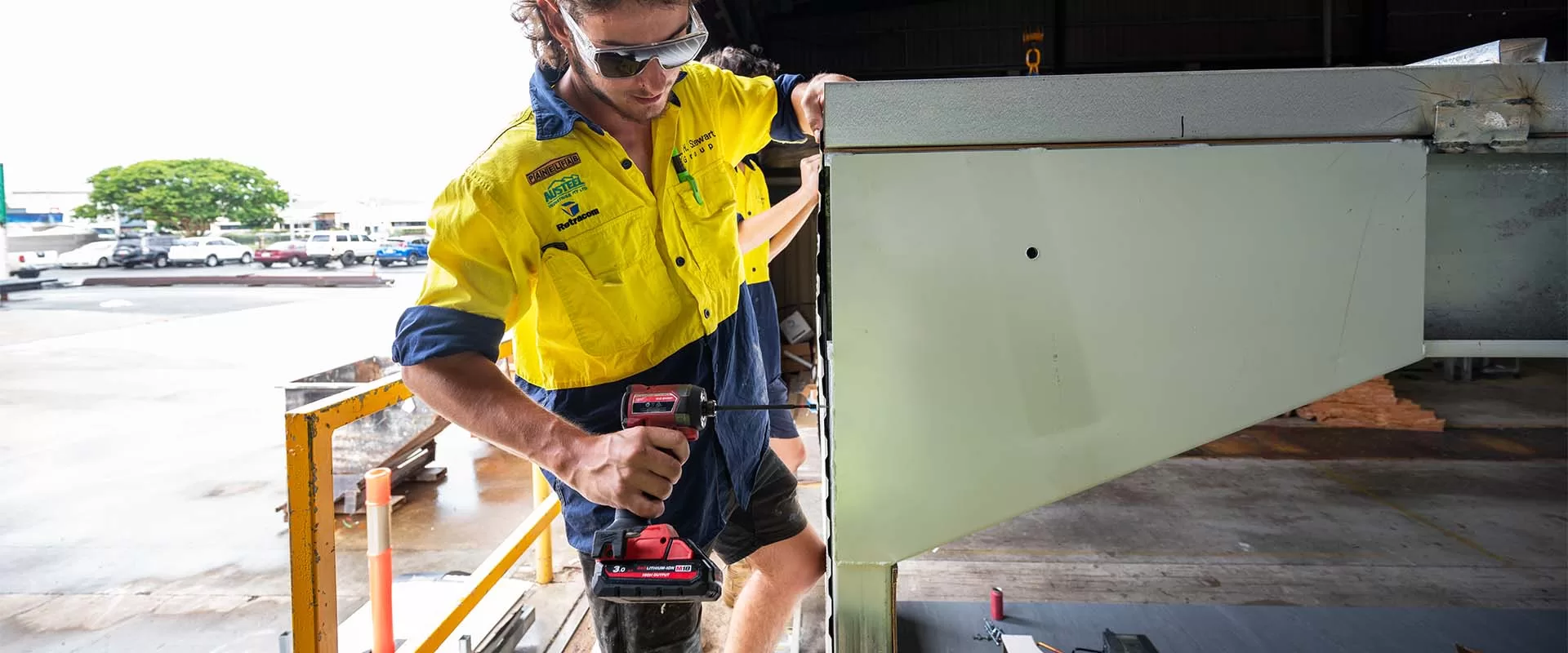 apprentice working on construction of roof