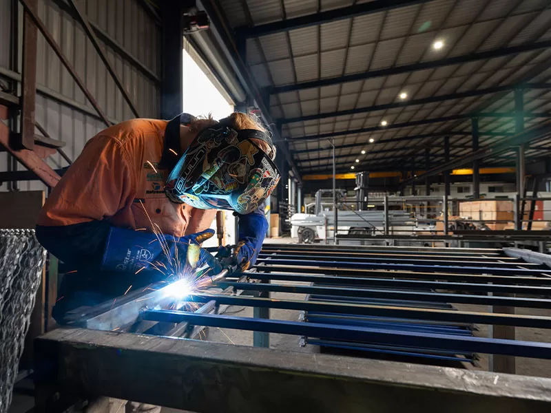 contractor using welder to construct a frame