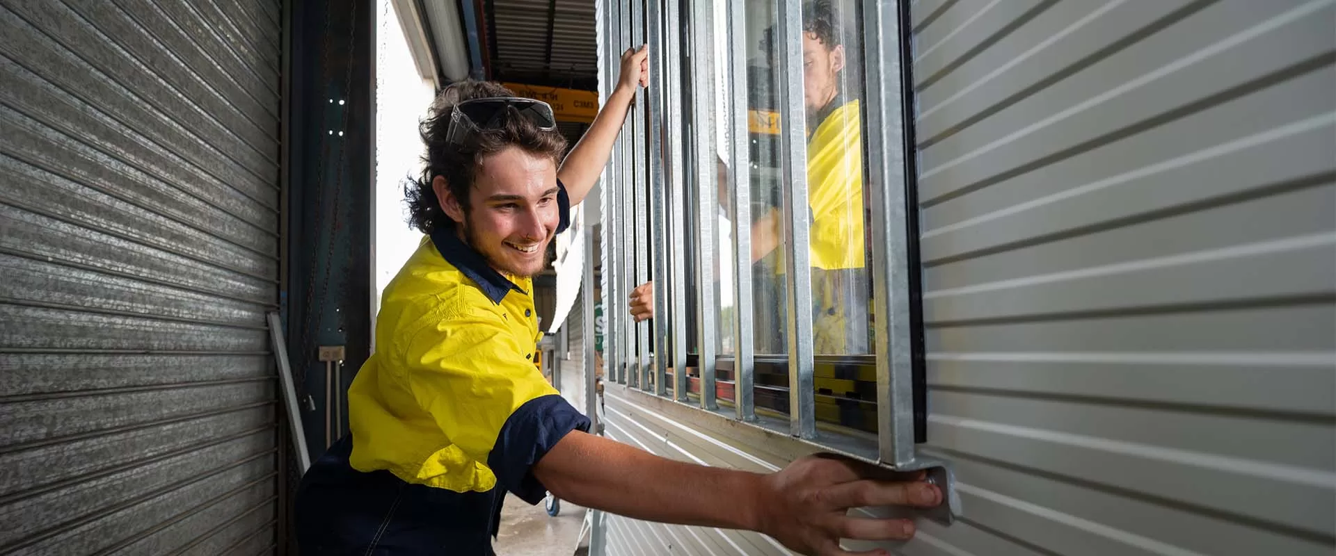 workshop junior putting window in building